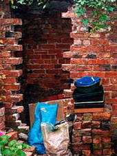 Shed wall demolition begins, November 1998